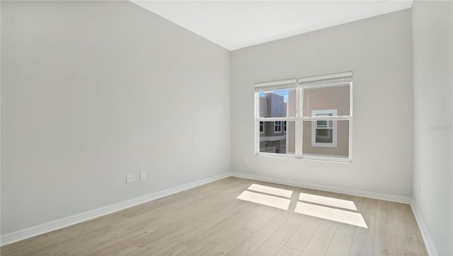 unfurnished room with light hardwood / wood-style floors