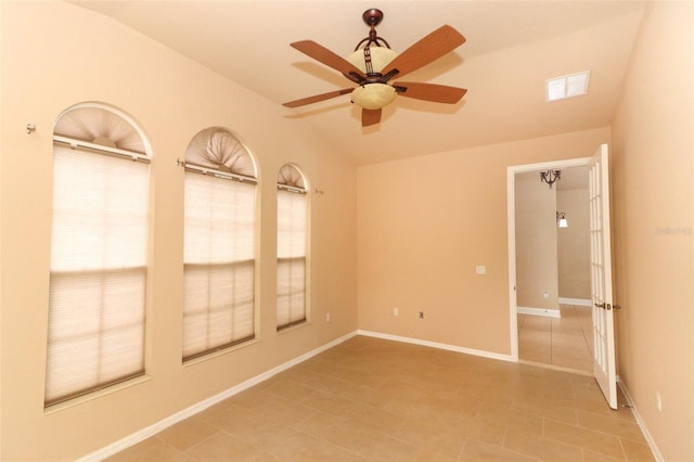 tiled empty room with ceiling fan