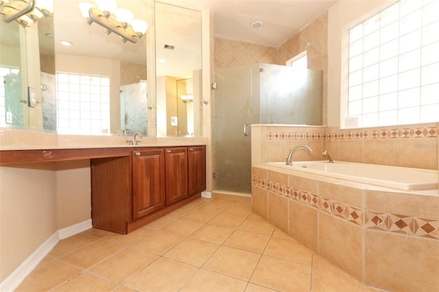 bathroom featuring vanity, independent shower and bath, and tile patterned floors