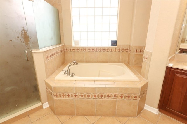 bathroom featuring vanity, separate shower and tub, and tile patterned floors