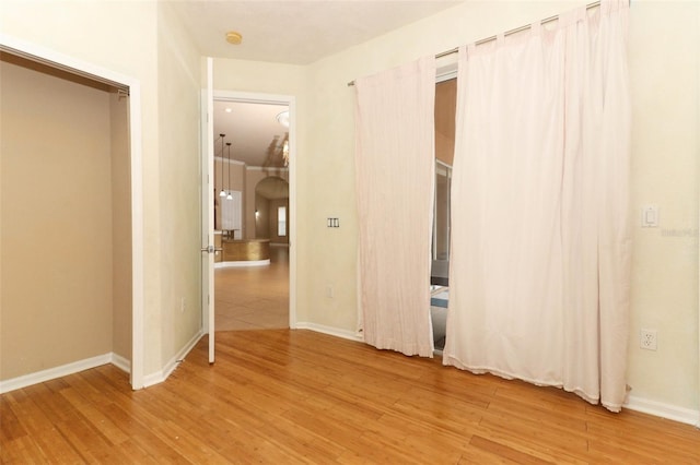 spare room featuring light hardwood / wood-style flooring