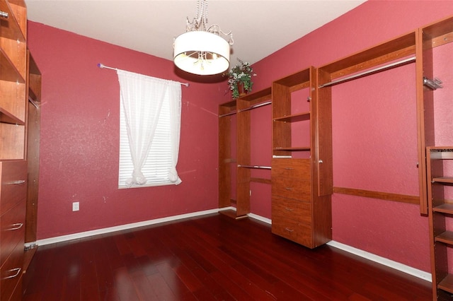 unfurnished bedroom with a closet and dark hardwood / wood-style flooring