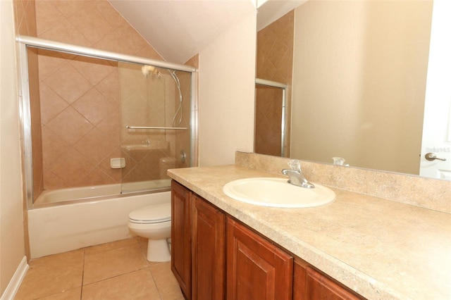 full bathroom with vanity, toilet, tile patterned floors, and enclosed tub / shower combo