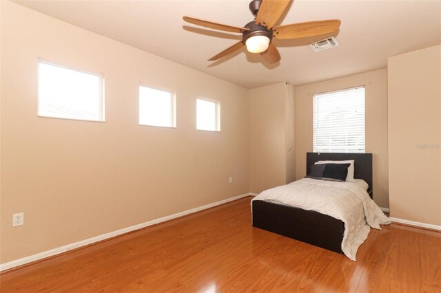 bedroom featuring ceiling fan and hardwood / wood-style flooring