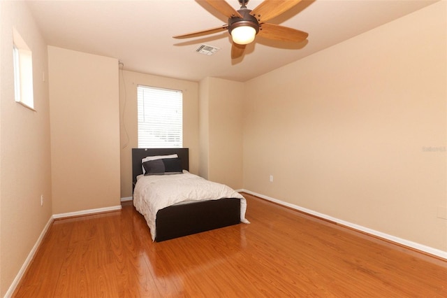 bedroom featuring ceiling fan and hardwood / wood-style flooring