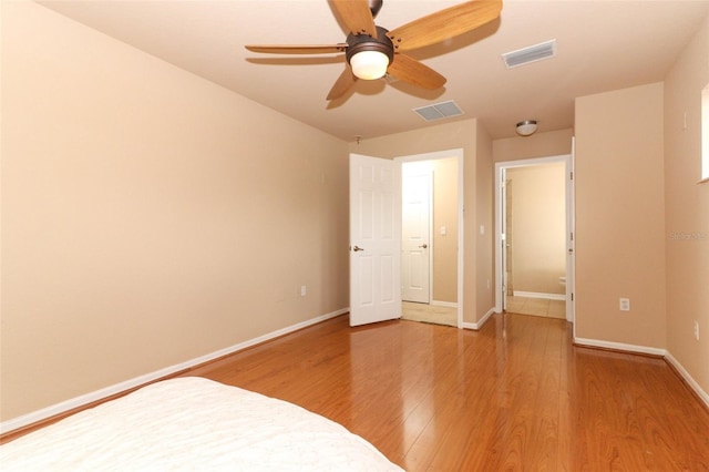 unfurnished bedroom featuring ceiling fan and wood-type flooring