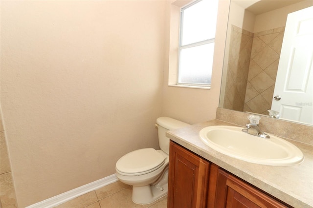 bathroom with vanity, toilet, and tile patterned floors