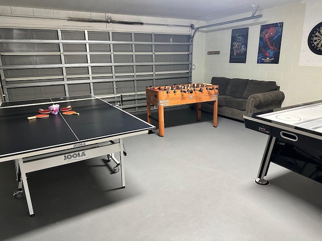 game room with concrete floors