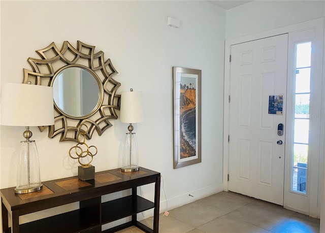 entrance foyer with light tile patterned floors