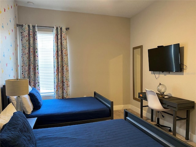 bedroom with carpet flooring and multiple windows