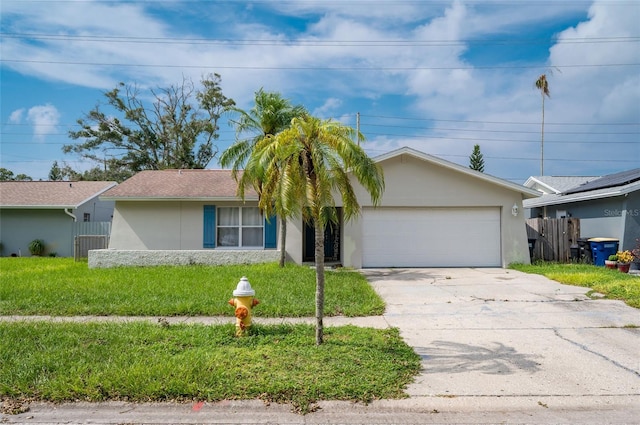 ranch-style home with a garage and a front yard