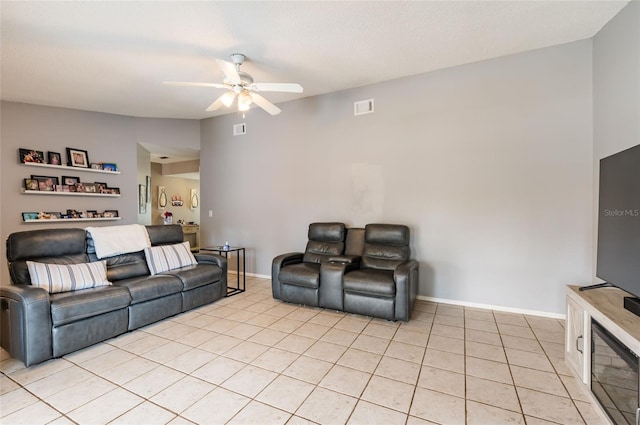 living room featuring light tile patterned floors and ceiling fan