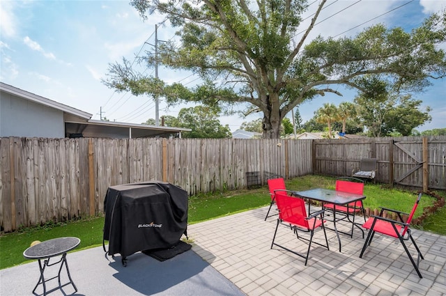 view of patio featuring a grill