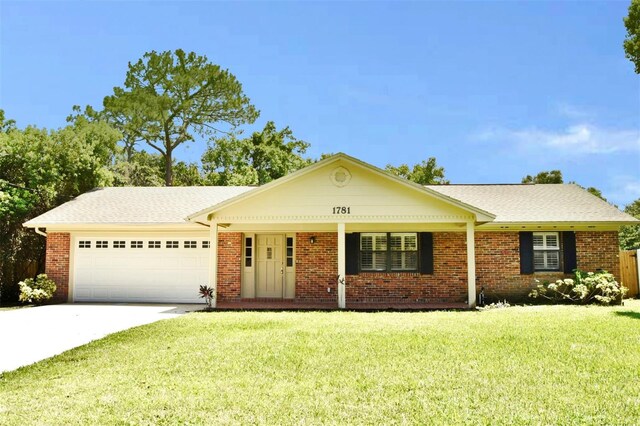 ranch-style home with a front lawn and a garage