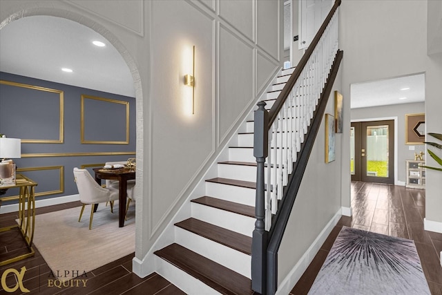 staircase featuring hardwood / wood-style flooring