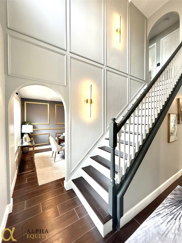 staircase featuring wood-type flooring