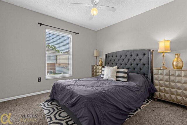 bedroom with ceiling fan, a textured ceiling, and carpet