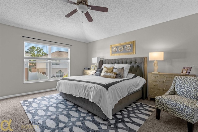 bedroom with a textured ceiling, ceiling fan, and carpet