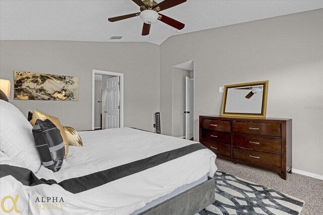 carpeted bedroom featuring ceiling fan and vaulted ceiling