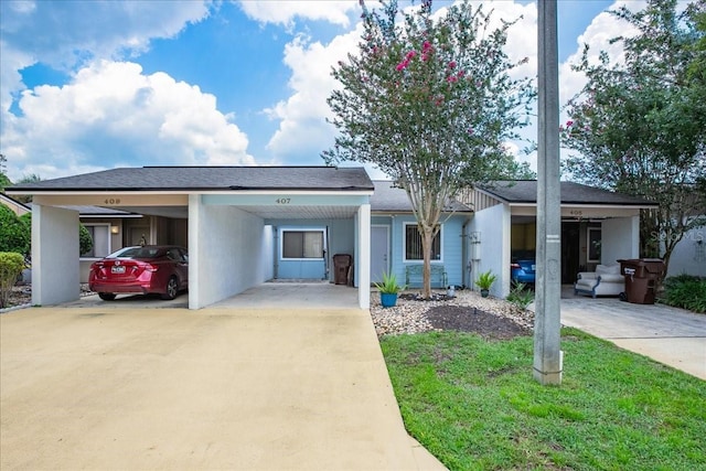 ranch-style house featuring a carport