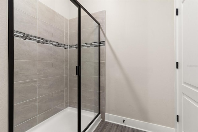 bathroom with hardwood / wood-style flooring