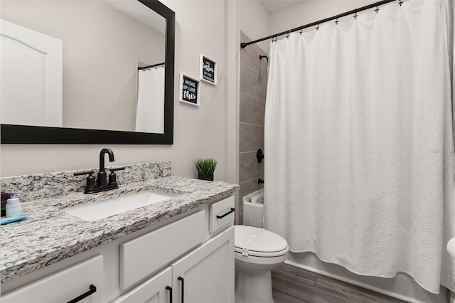 full bathroom with shower / bath combination with curtain, toilet, and vanity