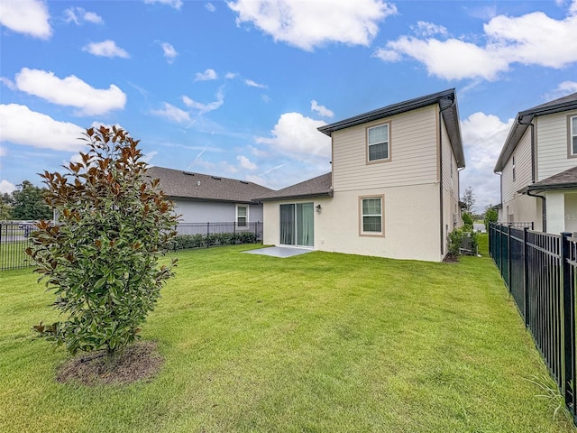 back of property with a lawn and central AC unit