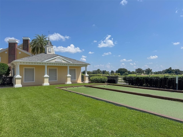 exterior space featuring a water view and a lawn