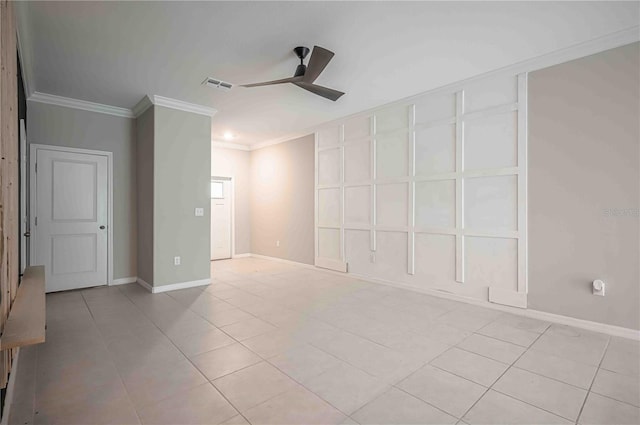 empty room with ceiling fan, light tile patterned flooring, and ornamental molding