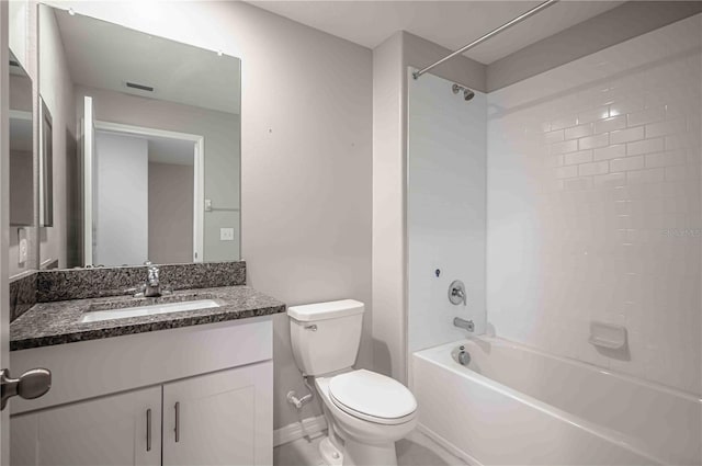 full bathroom featuring vanity, tiled shower / bath combo, and toilet