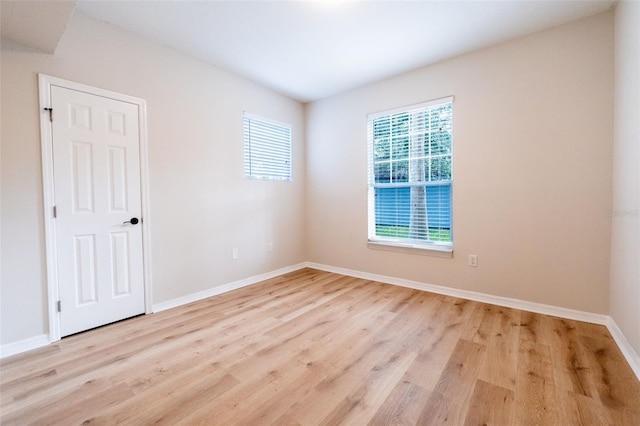 spare room featuring light wood-type flooring