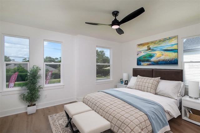 bedroom with ceiling fan and wood-type flooring