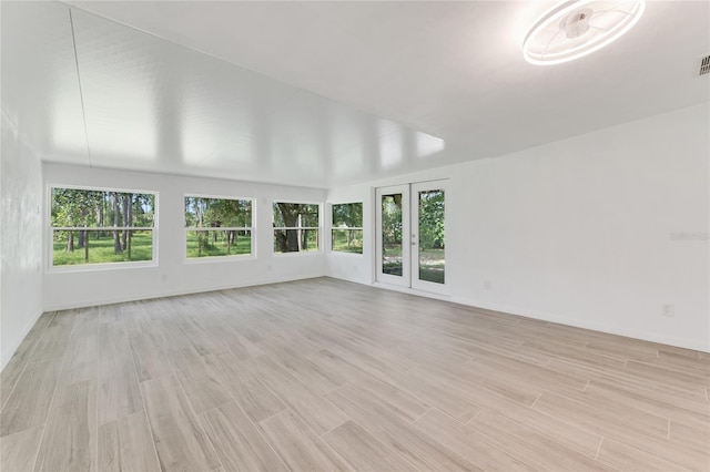 unfurnished sunroom featuring a healthy amount of sunlight