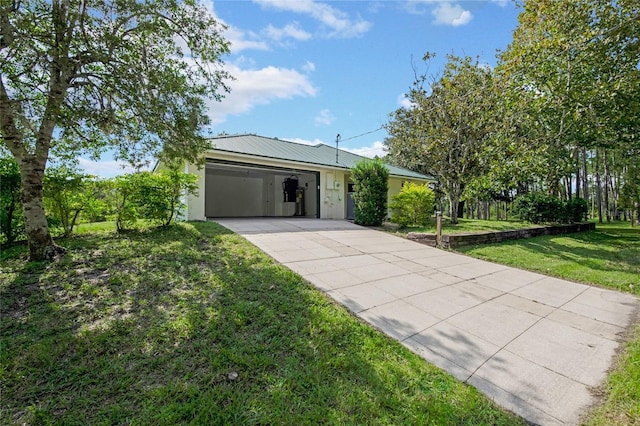 ranch-style house featuring a garage and a front yard