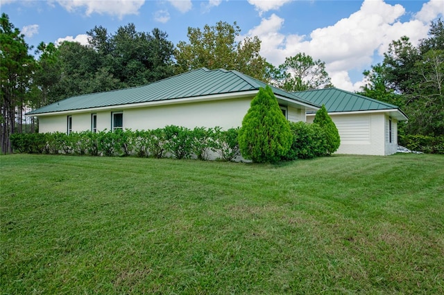 view of property exterior with a lawn