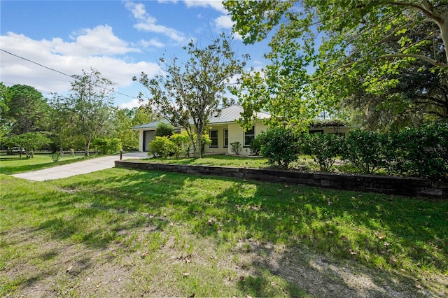 view of yard with a garage