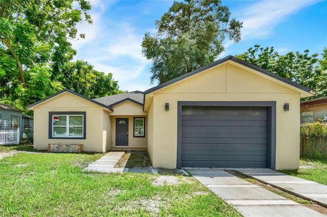 single story home with a front lawn and a garage