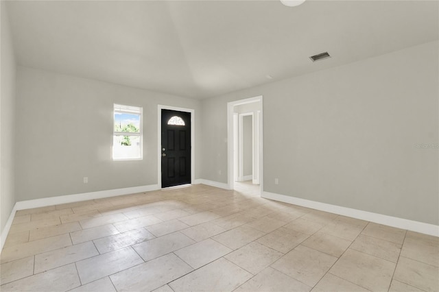 foyer entrance featuring light tile patterned floors