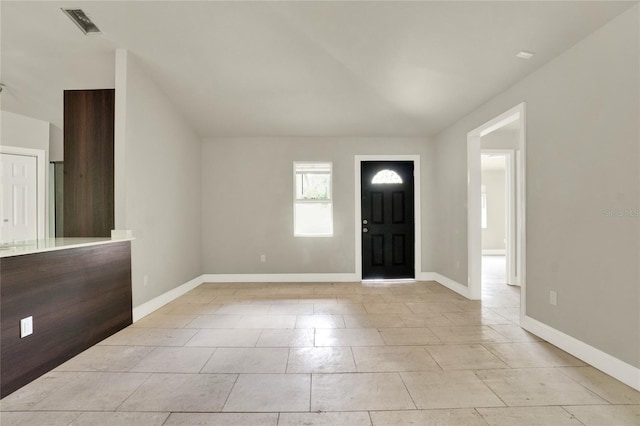 entrance foyer with light tile patterned floors