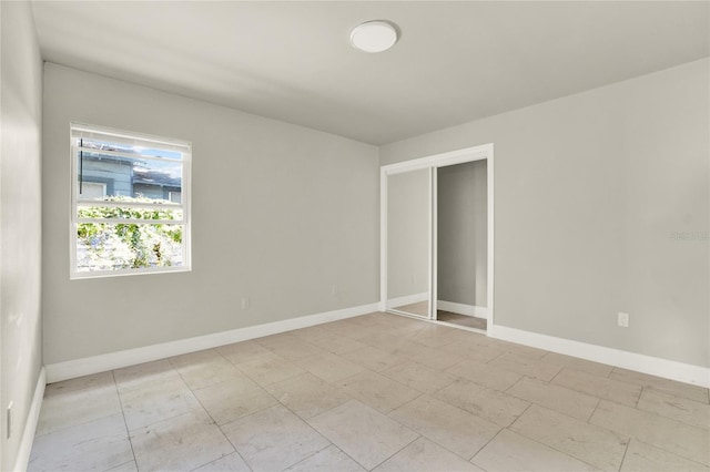 spare room with light tile patterned floors