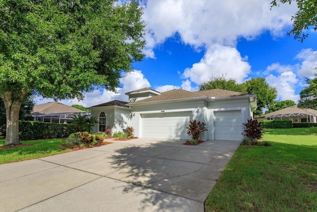 view of front of property with a garage and a front lawn