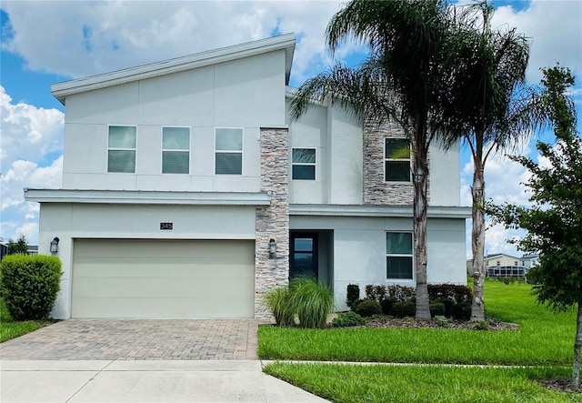 modern home with a garage and a front yard