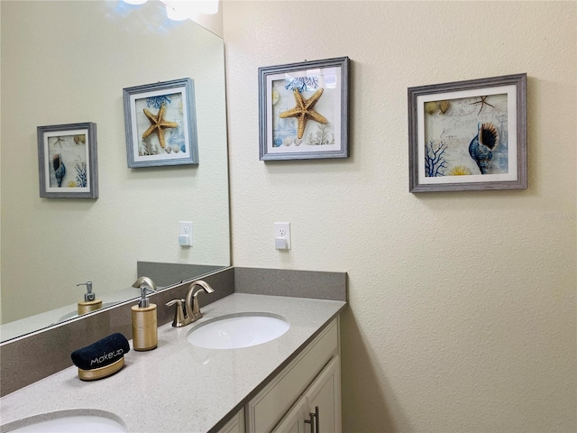 bathroom featuring double vanity