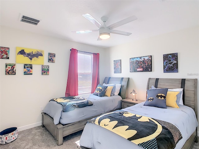 bedroom featuring light colored carpet and ceiling fan