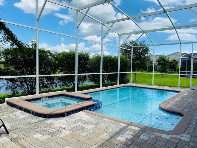 view of pool featuring glass enclosure, a patio, an in ground hot tub, and a lawn