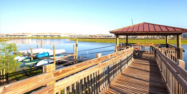 dock area with a gazebo and a water view