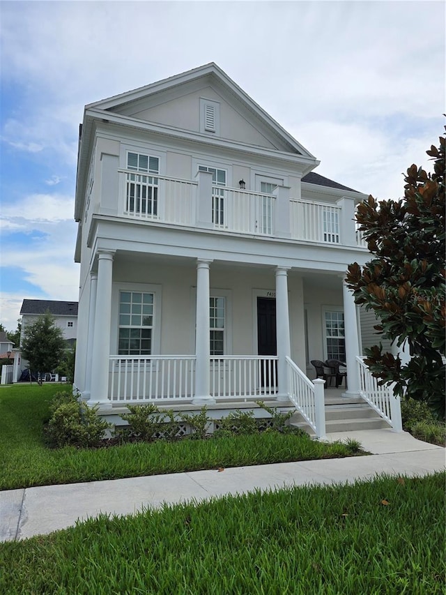 neoclassical home featuring covered porch