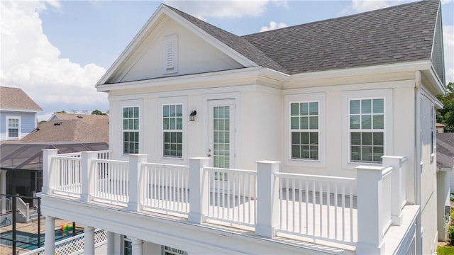 rear view of house featuring a wooden deck