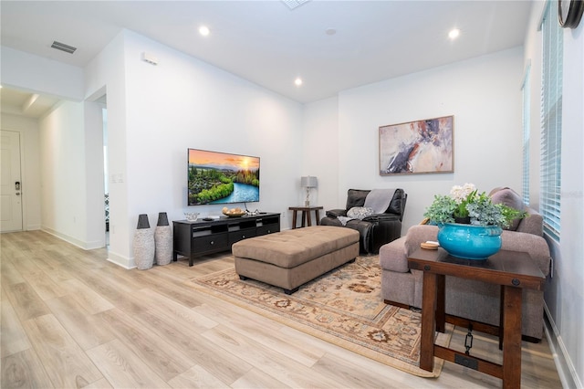 living room with light hardwood / wood-style flooring