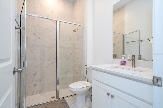 bathroom with a shower with shower door, tile patterned flooring, toilet, and vanity